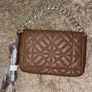 Chocolate quilted handbag with gold chain, can be used as a crossbody also.